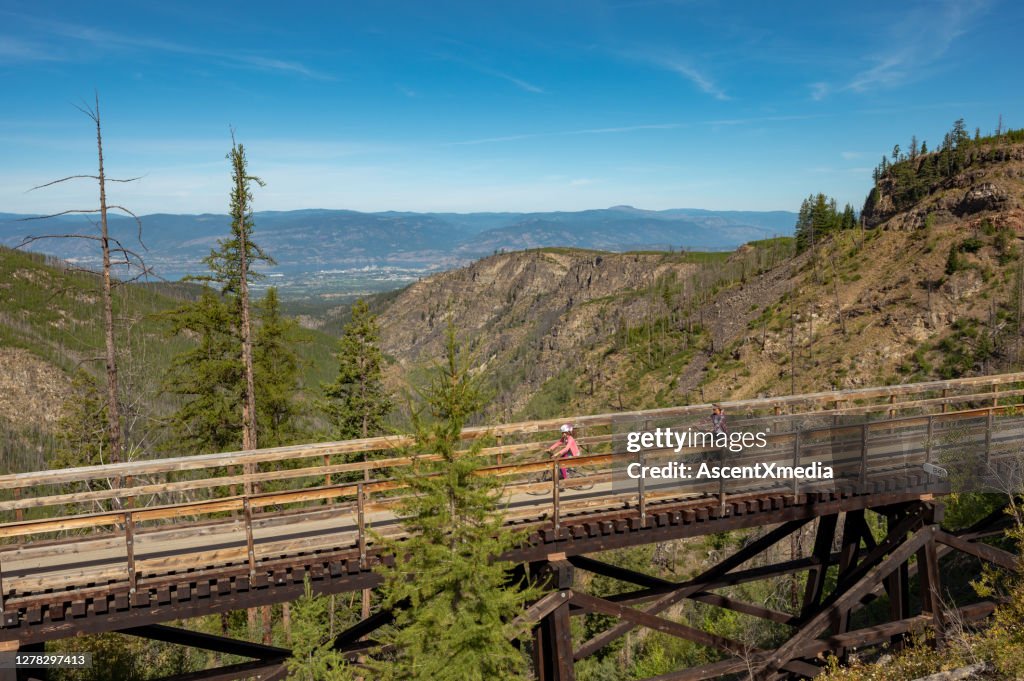 Family biking at the Myra Canyon Trestles near Kelowna