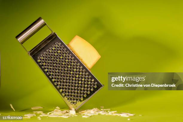 cheese grater and italian cheese - grattugia foto e immagini stock