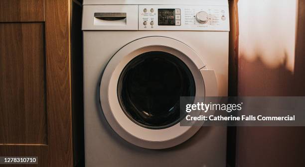 white washing machine in a utility room - abstellraum stock-fotos und bilder