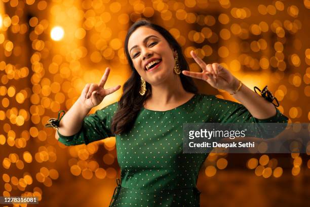 young woman diwali celebrate - stock photo - india celebrates diwali festival stock pictures, royalty-free photos & images