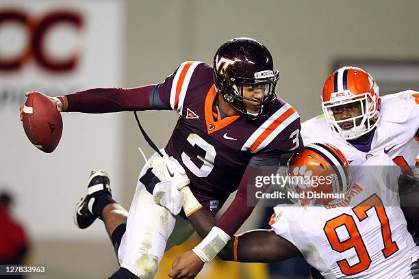 Logan Thomas of the Virginia Tech University Hokies is sacked by Malliciah Goodman of the Clemson University Tigers on October 1, 2011 at Lane...