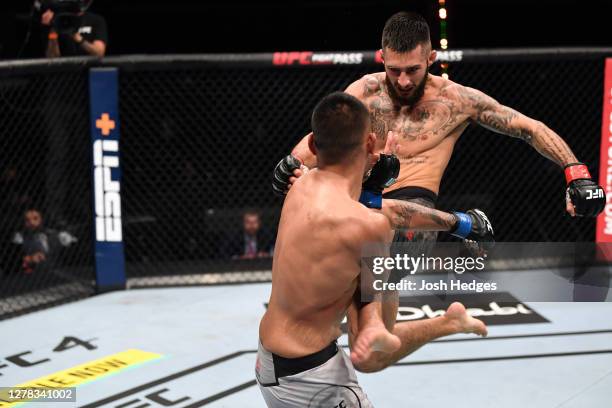 Charles Jourdain of Canada kicks Josh Culibao of Australia in their featherweight bout during the UFC Fight Night event inside Flash Forum on UFC...