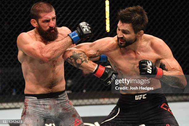 Carlos Condit lands an elbow against Court McGee in their welterweight bout during the UFC Fight Night event inside Flash Forum on UFC Fight Island...