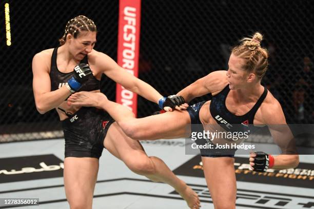 Holly Holm kicks Irene Aldana of Mexico in their women's bantamweight bout during the UFC Fight Night event inside Flash Forum on UFC Fight Island on...