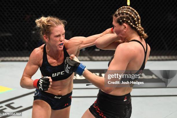 Holly Holm punches Irene Aldana of Mexico in their women's bantamweight bout during the UFC Fight Night event inside Flash Forum on UFC Fight Island...