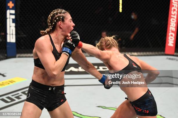 Holly Holm punches Irene Aldana of Mexico in their women's bantamweight bout during the UFC Fight Night event inside Flash Forum on UFC Fight Island...