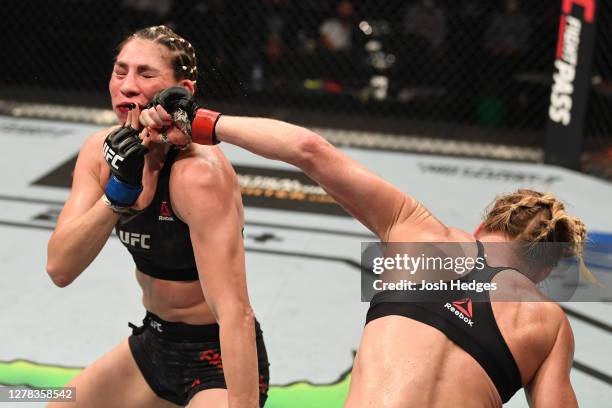 Holly Holm punches Irene Aldana of Mexico in their women's bantamweight bout during the UFC Fight Night event inside Flash Forum on UFC Fight Island...