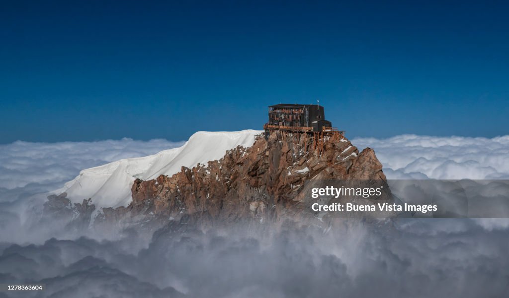 Alpine hut on a mountain top
