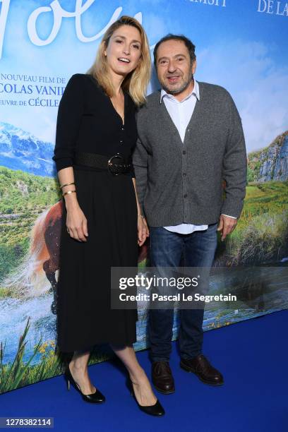 Julie Gayet and Patrick Timsit attend the "Poly" premiere at Cinema UGC Normandie on October 04, 2020 in Paris, France.