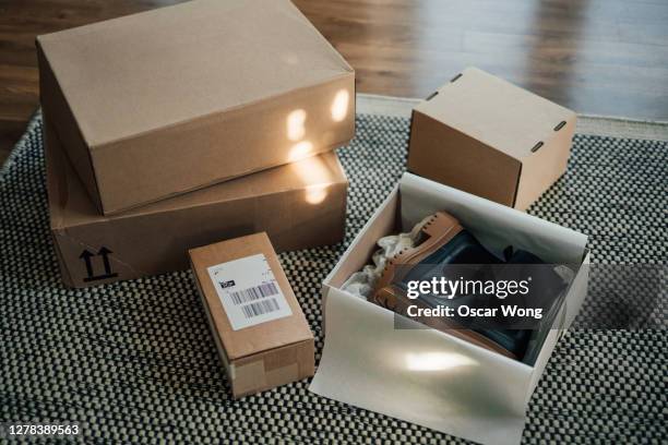 online shopping makes life easier - unboxing online purchase - shoes box stock-fotos und bilder