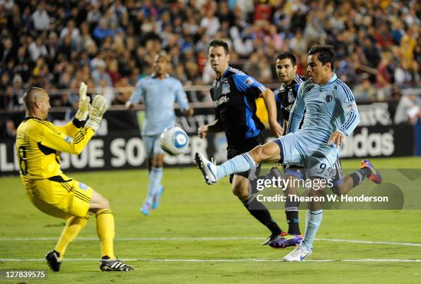 Omar Bravo of Sporting Kansas City tries to score on Jon Busch of the San Jose Earthquakes in the first half during an MLS soccer game at Buck Shaw...