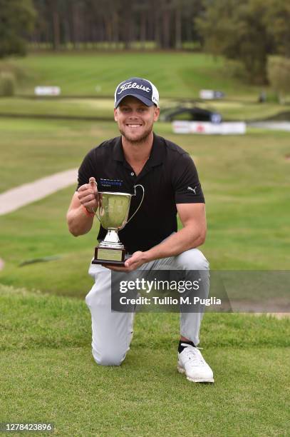 Hurly Long of Germany poses with the trophy after winning the Italian Challenge Open Eneos Motor Oil at Golf Club Castelconturbia on October 04, 2020...