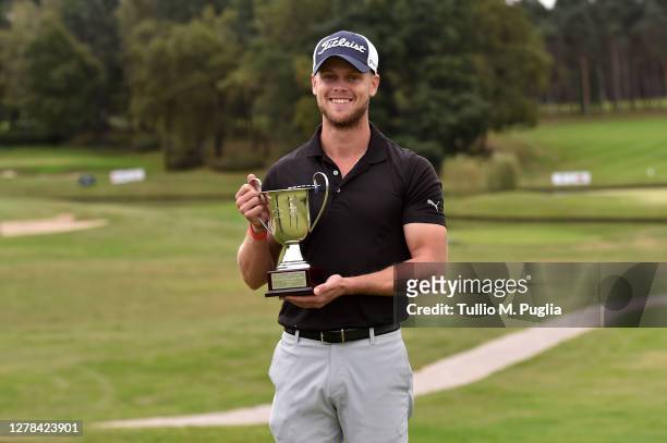 Hurly Long of Germany poses with the trophy after winning the Italian Challenge Open Eneos Motor Oil at Golf Club Castelconturbia on October 04, 2020...