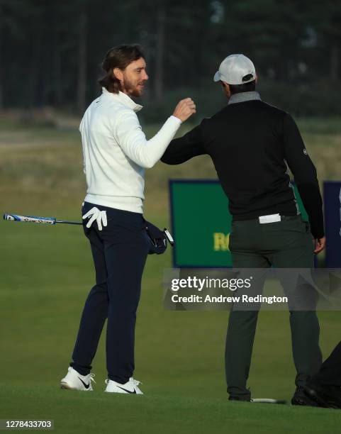 Tommy Fleetwood of England congratulates Aaron Rai of England after winning on the first play-off hole during the final round of the Aberdeen...