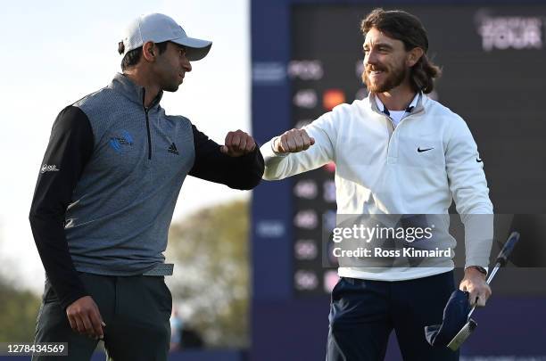 Tommy Fleetwood of England congratulates Aaron Rai of England after winning the Aberdeen Standard Investments Scottish Open after the first play-off...