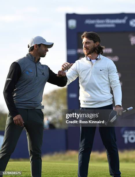 Tommy Fleetwood of England congratulates Aaron Rai of England after winning the Aberdeen Standard Investments Scottish Open after the first play-off...