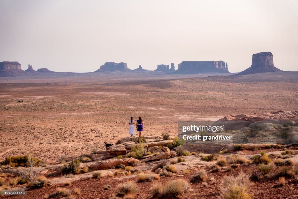 Two Teenage Navajo Native American Girls Looking over the Vast Desert in Northern Arizona Monument Valley Tribal Park Navajo Reservation