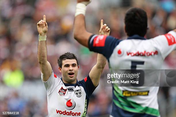 Jordan Meads of the Warriors celebrates with team mates after kicking a field goal in extra time to win the 2011 Toyota Cup Grand Final match between...