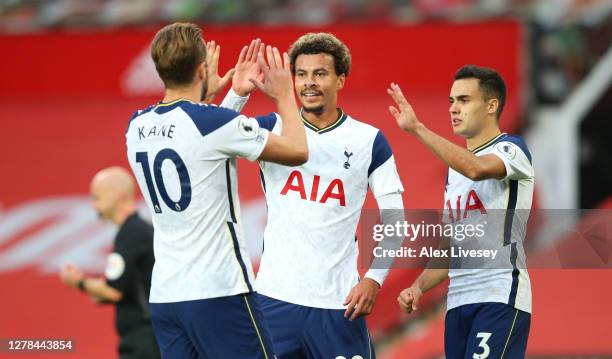 Harry Kane of Tottenham Hotspur celebrates with teammates Dele Alli and Sergio Reguilon after scoring his sides sixth goal during the Premier League...