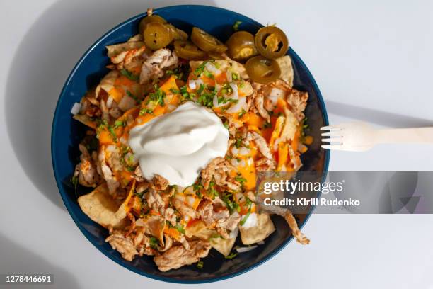 nachos in a bowl - mexican food plate stock pictures, royalty-free photos & images