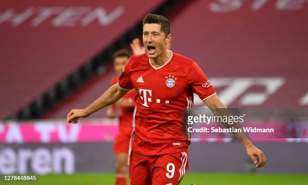 Robert Lewandowski of Bayern Munich celebrates after scoring his team's third goal during the Bundesliga match between FC Bayern Muenchen and Hertha...