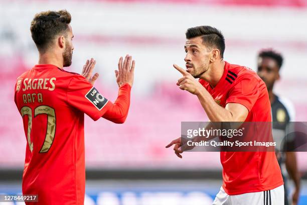 Luís Miguel Afonso Fernandes 'Pizzi' of SL Benfica celebrates with Rafa Silva after scoring his team's first goal during the Liga NOS match between...