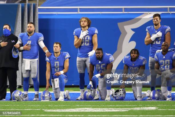 Matthew Stafford of the Detroit Lions kneels for the National Anthem prior to playing the New Orleans Saints at Ford Field on October 04, 2020 in...