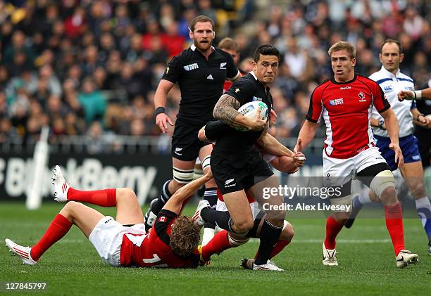 Sonny Bill Williams of the All Blacks powers through the Canada defence during the IRB 2011 Rugby World Cup Pool A match between France and Tonga at...