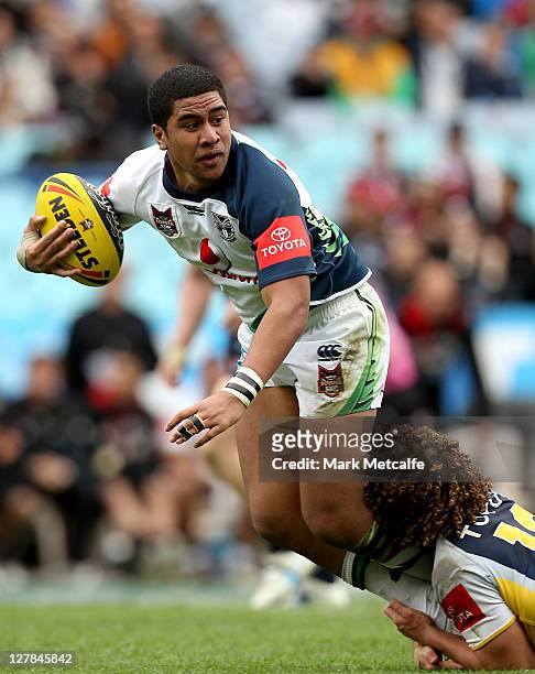 Tennyson Elliott of the Warriors is tackled during the 2011 Toyota Cup Grand Final match between the Warriors and the North Queensland Cowboys at ANZ...