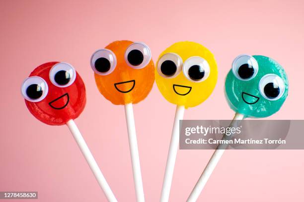 lollipops with cartoon eyes - googly eyes stock pictures, royalty-free photos & images