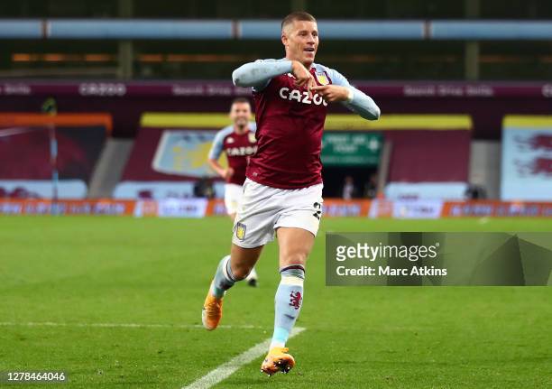 Ross Barkley of Aston Villa celebrates after scoring his team's fifth goal during the Premier League match between Aston Villa and Liverpool at Villa...