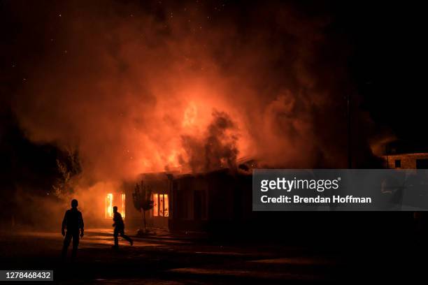 Fire burns in a hardware store after a rocket attack caused the building to catch fire on October 3, 2020 in Stepanakert, Nagorno-Karabakh. A...