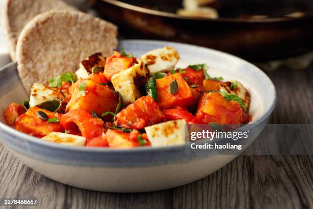 crispy grilled halloumi with butternut squash stew - grilled halloumi stock pictures, royalty-free photos & images