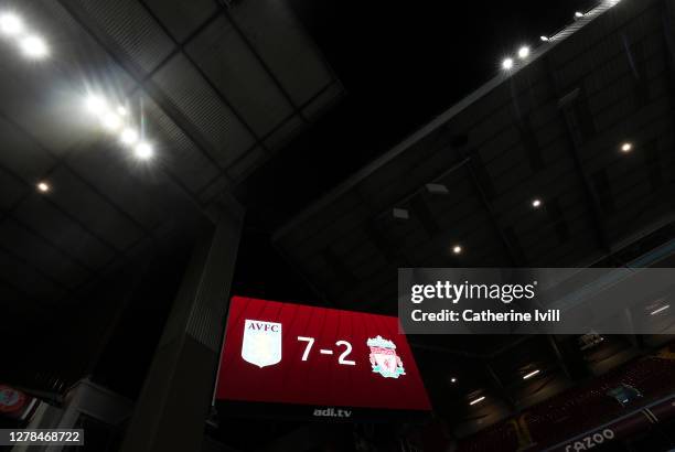 The big screen shows the final score of 7-2 after the Premier League match between Aston Villa and Liverpool at Villa Park on October 04, 2020 in...