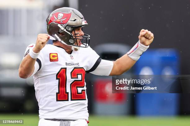 Tom Brady of the Tampa Bay Buccaneers celebrates after defeating the Los Angeles Chargers after a game at Raymond James Stadium on October 04, 2020...