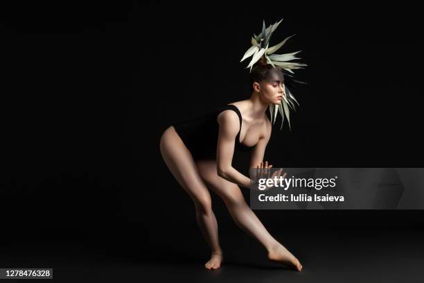 graceful woman with creative hairstyle in studio - perfect female body shape stock pictures, royalty-free photos & images