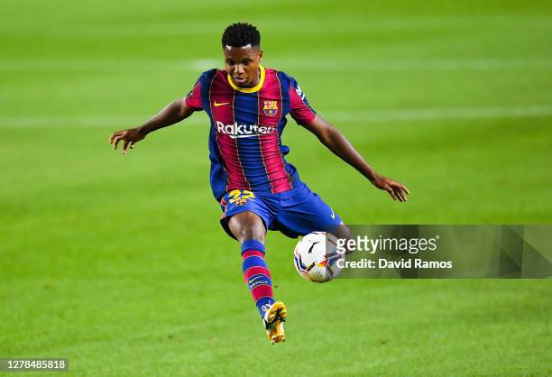 Ansu Fati of FC Barcelona controls the ball during the La Liga Santander match between FC Barcelona and Sevilla FC at Camp Nou on October 04, 2020 in...