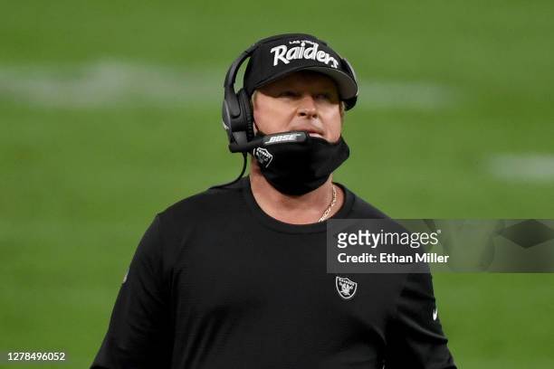 Head coach Jon Gruden of the Las Vegas Raiders wears a protective face mask incorrectly on the sideline against the Buffalo Bills during the fourth...