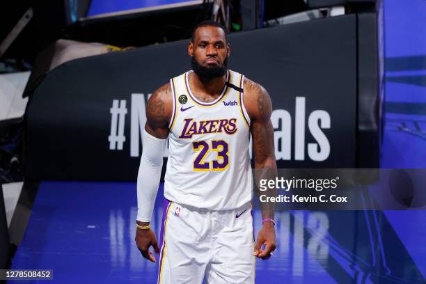 LeBron James of the Los Angeles Lakers reacts after being fouled while shooting during the second half against the Miami Heat in Game Three of the...