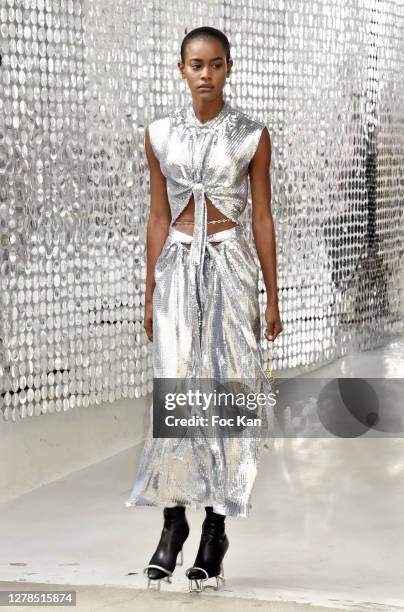 Model walks the sidewalk as runway from backstage to Stage during the Paco Rabanne Womenswear Spring/Summer 2021 show as part of Paris Fashion Week...