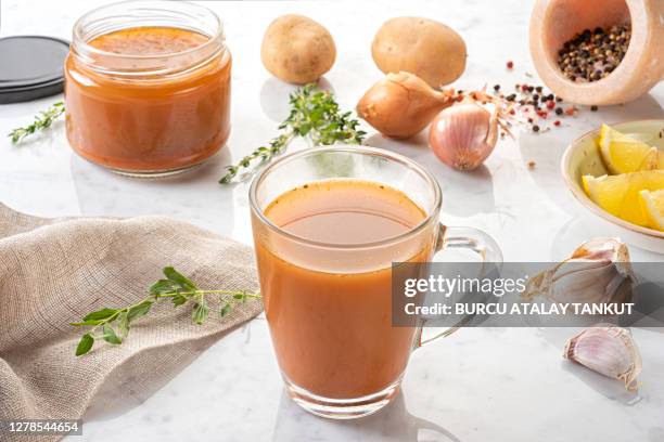 healthy beef bone broth - bone broth stock pictures, royalty-free photos & images