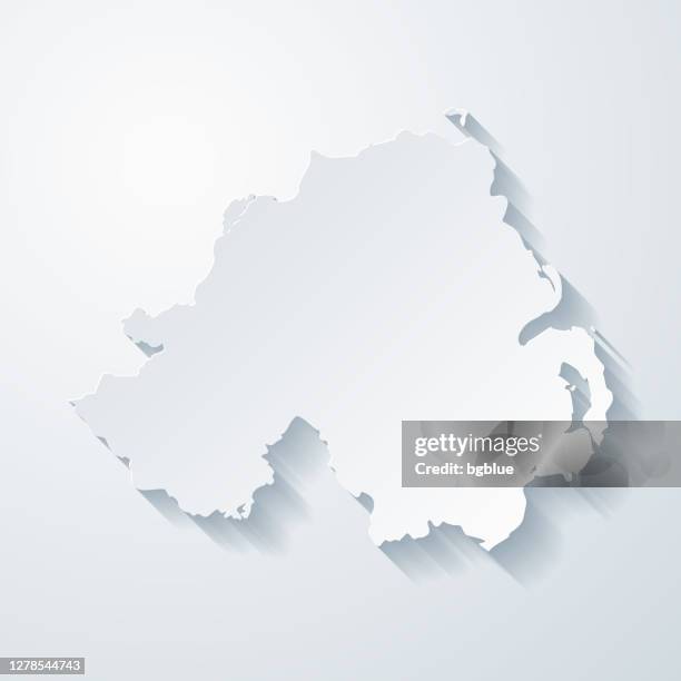 northern ireland map with paper cut effect on blank background - belfast stock illustrations