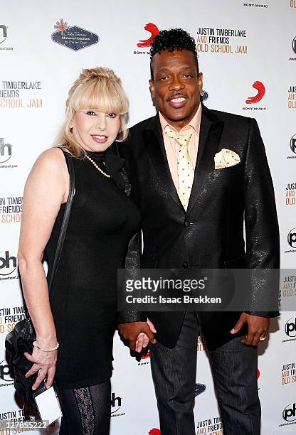 Singer Charlie Wilson and his wife Mahin Wilson arrive at the Justin Timberlake and Friends Old School Jam concert benefiting Shriners Hospitals for...