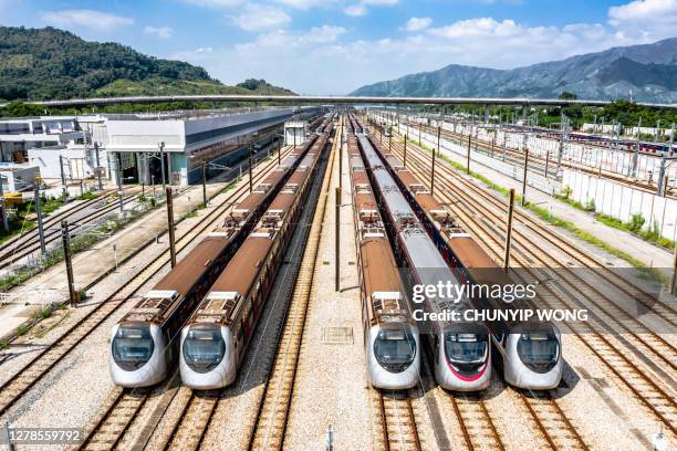 high angle aerial view of mtr pat heung maintenance centre depot with train lines - hong kong high speed train stock pictures, royalty-free photos & images