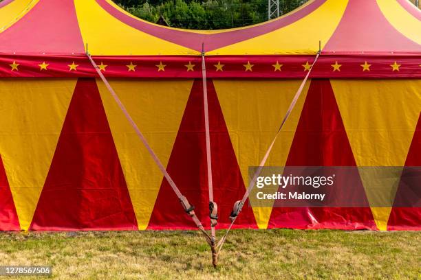 red and yellow circus tent. - circus background stock pictures, royalty-free photos & images