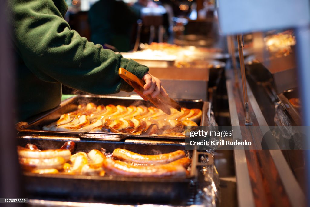 Sausages being fried at at christmas market stall in Dresden, Germany