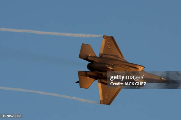 Israel's F-35 Lightning II fighter jet performs during the graduation ceremony of Israeli Air Force pilots at the Hatzerim base in the Negev desert,...