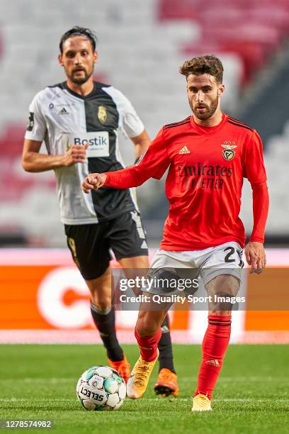 Rafa Silva of SL Benfica is challenged by Nikola Stojiljkovic of SC Farense during the Liga NOS match between SL Benfica and SC Farense at Estadio da...