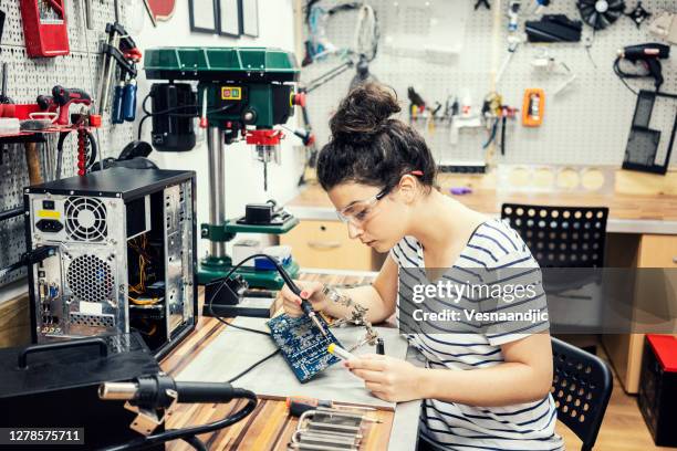 young woman repairing and assembling pc computer - disassembling stock pictures, royalty-free photos & images