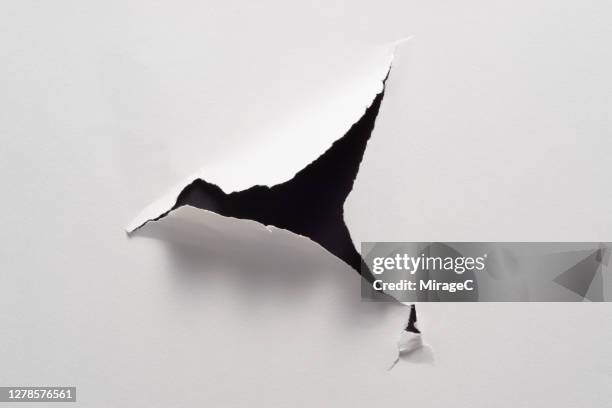 triangle shape paper hole - sharp stock pictures, royalty-free photos & images